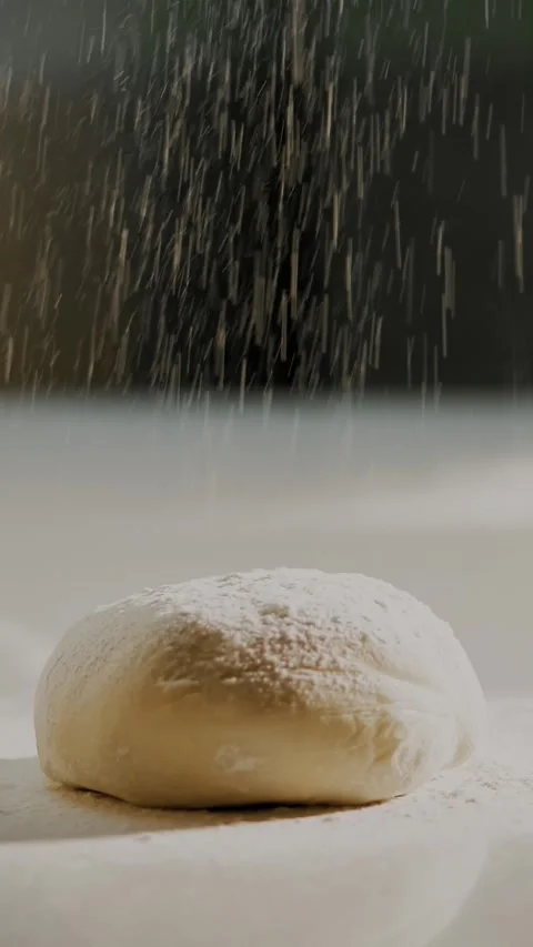 Cooking, bakery . close-up. the chef sprinkles flour to blank for baking, which Stock-Footage 321012710