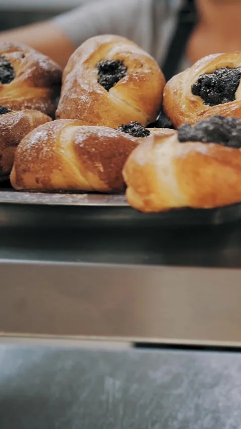Cooking. bakery. culinary. Close-up. the waitress serves dough buns and pies on Video stock 319016881