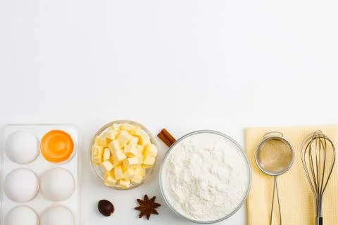 Cooking baking flat lay background with eggs butter kitchen tools Stock Photos