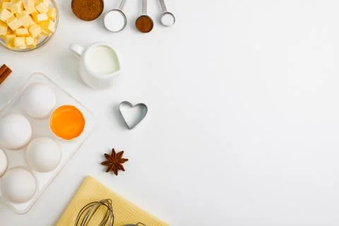 Cooking baking flat lay background with eggs butter kitchen tools Stock Photos