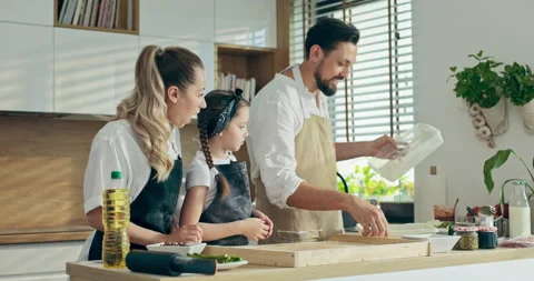 Cooking baking process. Young beautiful mother with small preschooler daughter 스톡 동영상 218636631