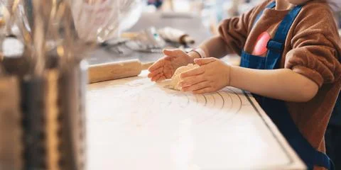 Cooking baking workshop class for school kids. Cute girl playful Stock Photos