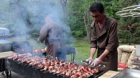 Cooking barbecue at picnic Stock Footage 49669145
