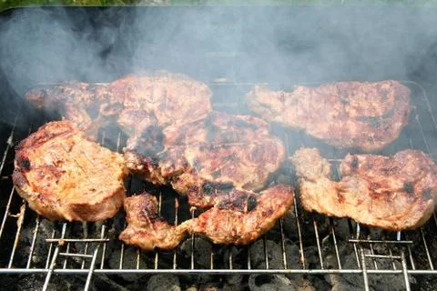 Cooking barbecue steak Stock Photos