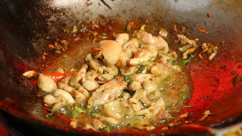 Cooking basil fried chicken or Pad Kra Prao  in pan, Thai famous street food Stock Footage 106928763