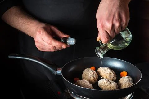 Cooking beef cutlets in a grill pan with the hands of a chef Stock Photos
