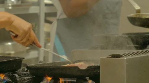 Cooking a beef on a heated pan Video stock 111001753