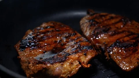 Cooking a beef steak. Stock Footage 116347324
