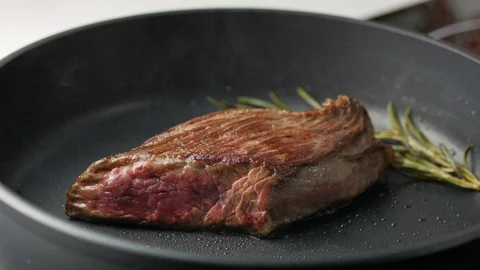Cooking Beef Steak On A Frying Pan Stock Footage 128455243
