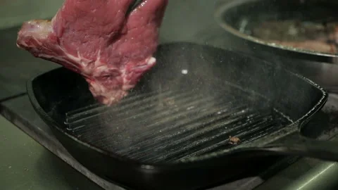 Cooking beef steak. One beef fillet meat is being fried in a grill pan. Stock-Footage 106264974