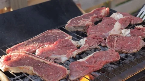 Cooking beef steaks on a barbecue grill Stock Footage 91275901