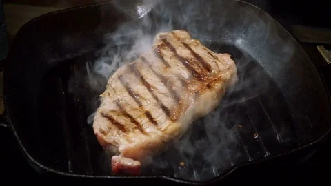Cooking beefsteak. One beef fillet meat is being fried in a broiler pan. 4K 스톡 동영상 84233756