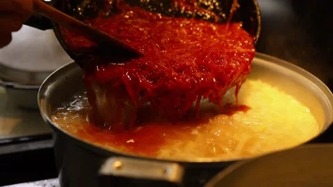 Cooking beet soup or borscht ukrainian traditional meal at domestic kitchen on a Stock Footage 149437811