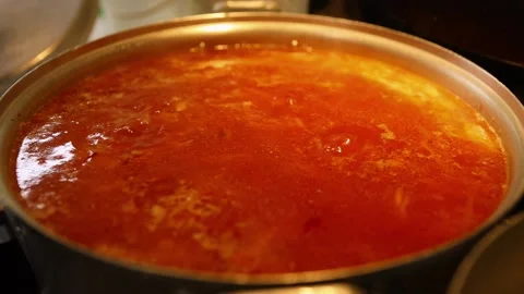 Cooking beet soup or borscht ukrainian traditional meal at domestic kitchen on a Stock Footage 149437819