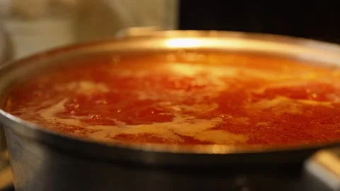 Cooking beet soup or borscht ukrainian traditional meal at domestic kitchen on a Stock Footage 149437861
