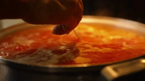 Cooking beet soup or borscht ukrainian traditional meal at domestic kitchen on a Stock Footage 149437872