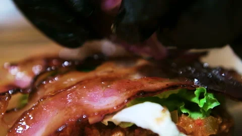 Cooking a big burger, fried red onions. Closeup. Stock Footage 101750855