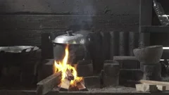 https://images.pond5.com/cooking-big-pot-pan-fire-footage-202203740_iconm.jpeg