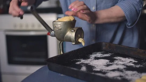 Cooking biscuits with ingredients on the table using a meat grinder. Video stock 128532130