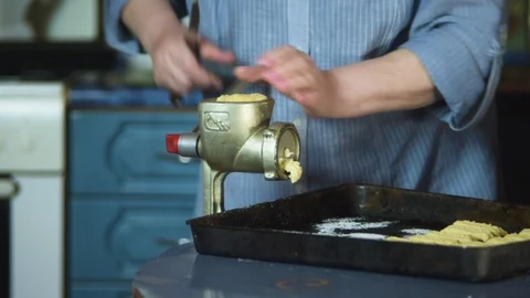 Cooking biscuits with ingredients on the table using a meat grinder. Stock Footage 128544532