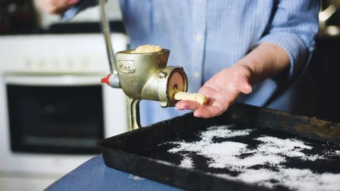 Cooking biscuits with ingredients on the table using a meat grinder. Stock Footage 128544658