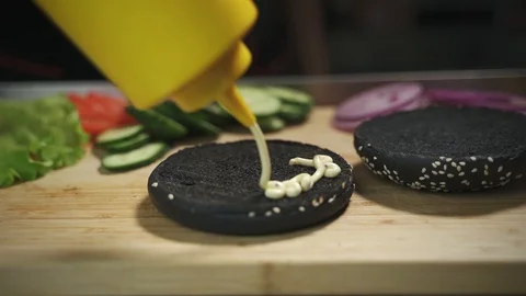 Cooking black burger Stock Footage 129685361