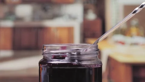 Cooking blueberry raspberry berrie jam with sugar, boiling marmalade, Jar of Stock Footage 296014631