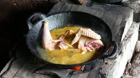 Cooking boiled chicken with yellow spices in a frying Stock Footage 301291237