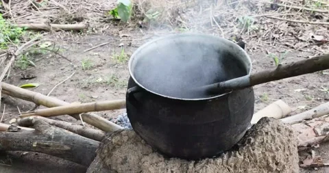 Cooking Boiling cocoa beans village fire Ghana Africa 4K Stock Footage 161734489