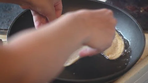 Cooking in boiling oil Stock Footage 78233610