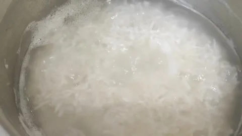 Cooking Boiling Rice 2 Stock Footage 301789368
