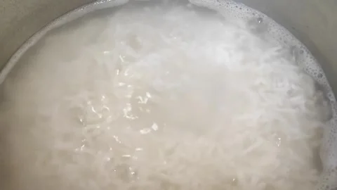 Cooking Boiling Rice 4 Stock Footage 301789374