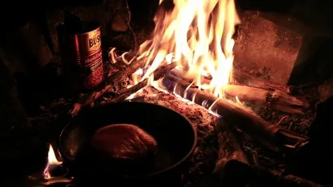Cooking on a bonfire Stock Footage 73059433