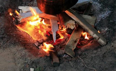 The cooking on a bonfire Stock Photos