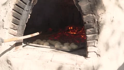 Cooking bread in clay oven traditional bakery of pastry Stock Footage 266828953
