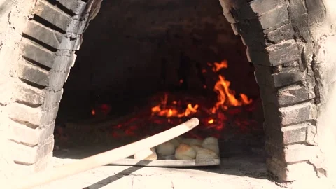 Cooking bread in clay oven traditional bakery of pastry Stock Footage 266828971