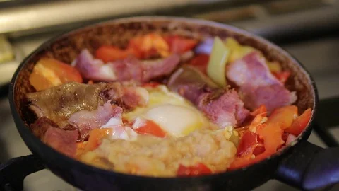 Cooking breakfast in a pan Stock-Footage 117277570
