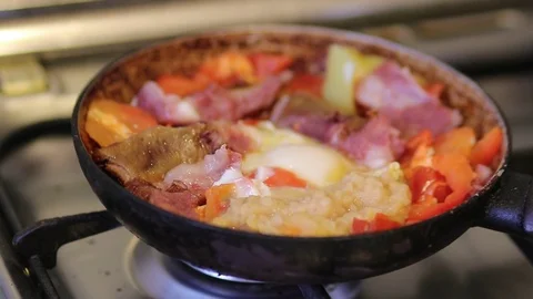 Cooking breakfast in a pan Video stock 117278084