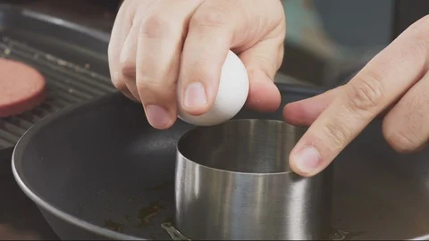 Cooking: Breaking An Egg into A Round Mold On A Frying Pan (Male Chef Hand) 스톡 동영상 118593098