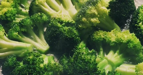 Cooking broccoli in a frying pan close-up. Homemade healthy, veggie food Stock Footage 282762849