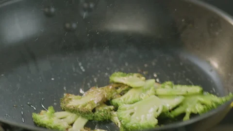 Cooking broccoli in a pan Stock Footage 151274239