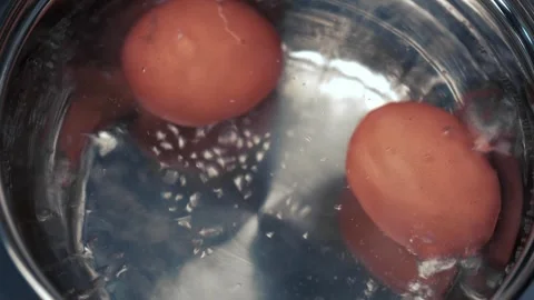 Cooking brown eggs for a quick breakfast. healthy nutrition. closeup. Stock Footage 256157531