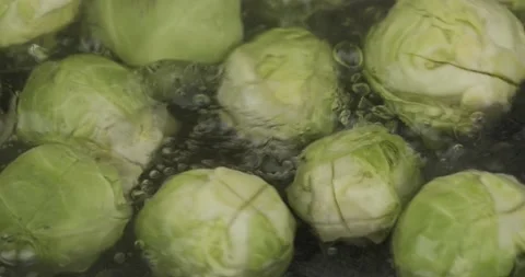 Cooking brussels sprouts closeup selective focus Stock Footage 153358243