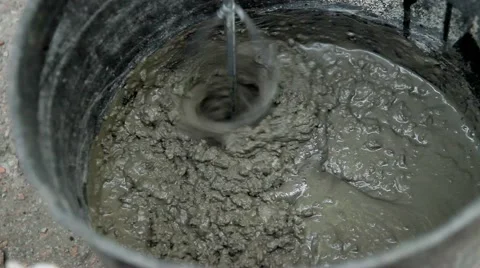 Cooking in a bucket of cement Stock Footage 66692402
