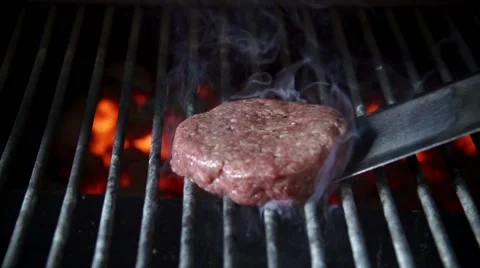 Cooking burger in slow motion Stock Footage 67856941