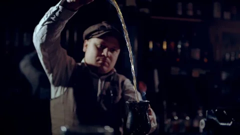 Cooking burning punch or grog.  It can be a “Blue Blazer” punch. Stock Footage 124386583
