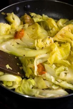 Cooking cabbage dish, closeup Stock Photos
