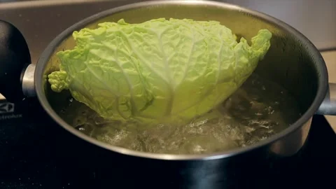 Cooking cabbage leaves a pot of boiling water. Stock Footage 280649595