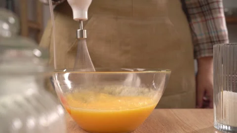 Cooking cake and pastry. Top view of chef beats eggs with sugar using immer.. Stock Footage 340210477