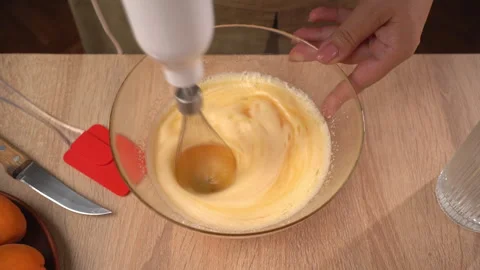 Cooking cake and pastry. Top view of chef beats eggs with sugar using immer.. Stock Footage 340210537